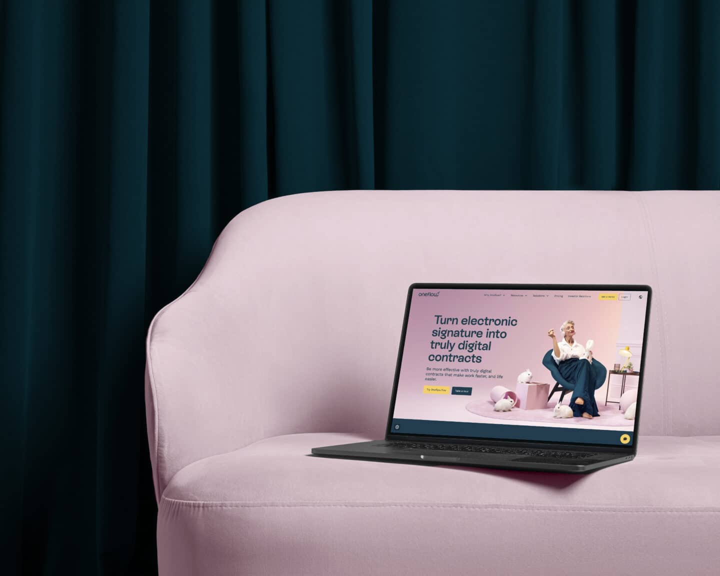 Laptop showing Oneflow website on pink sofa - blog on applications for AI in B2B