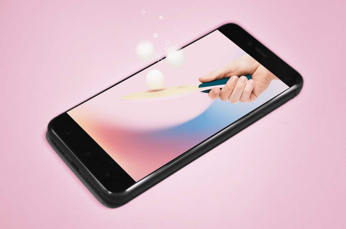 Phone on pink background with table tennis bat bouncing balls coming out of the phone – blog on 7 things you can do using Oneflow besides e-signature