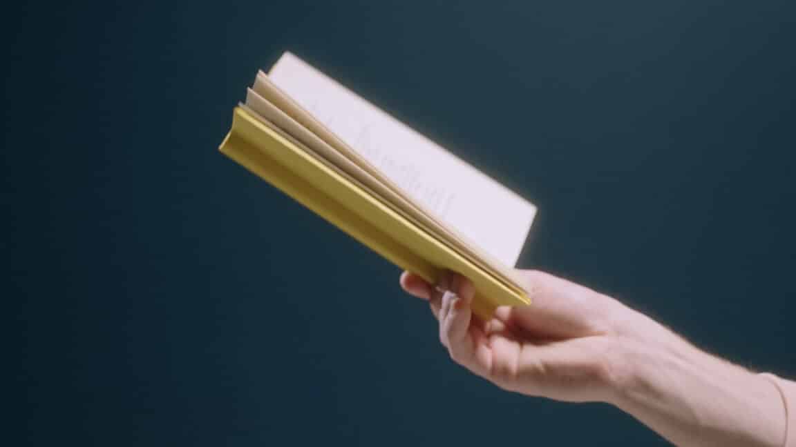what is contract automation - holding a book - Oneflow
